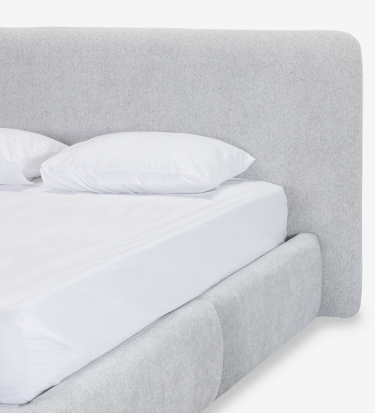 Double bed with short headboard, upholstered in grey fabric.