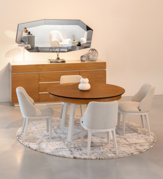 Round extendable dining table with honey oak top and pearl lacquered legs.