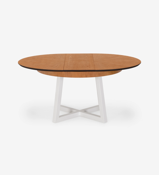 Round extendable dining table with honey oak top and pearl lacquered legs.
