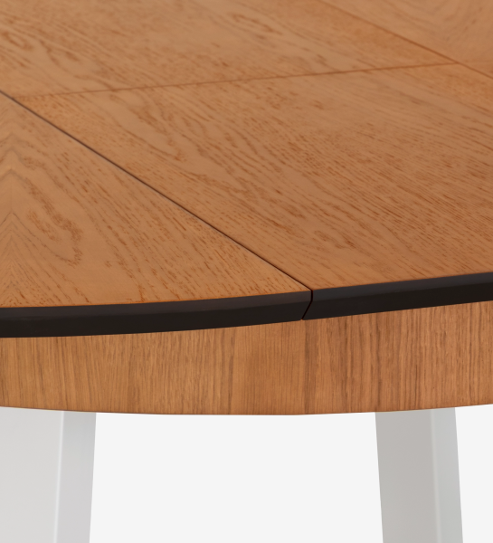 Round extendable dining table with honey oak top and pearl lacquered legs.