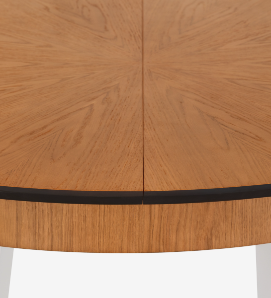 Round extendable dining table with honey oak top and pearl lacquered legs.