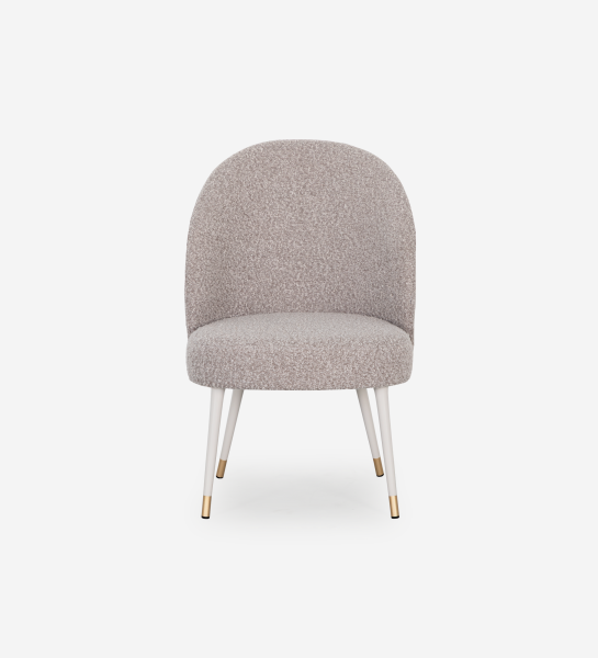 Geneve armchair upholstered in toffee fabric, pearl lacquered feet and golden detail.