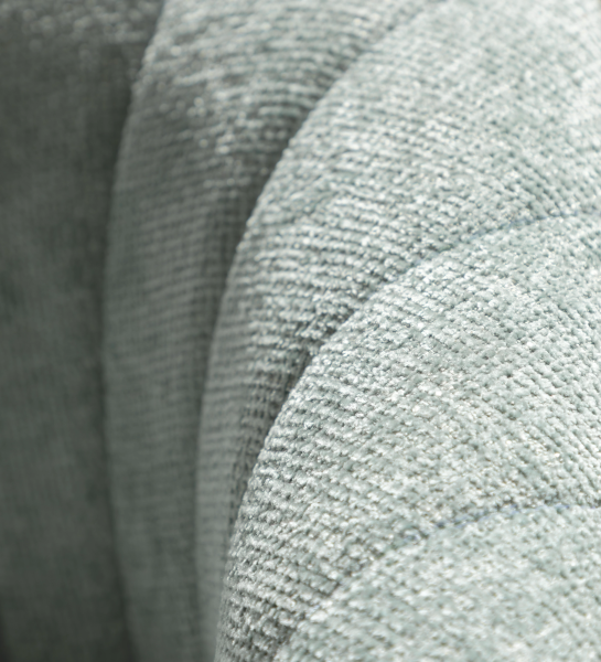 Tokyo armchair upholstered in aqua green fabric, black lacquered legs.