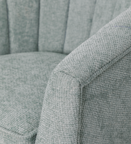 Tokyo armchair upholstered in aqua green fabric, black lacquered legs.