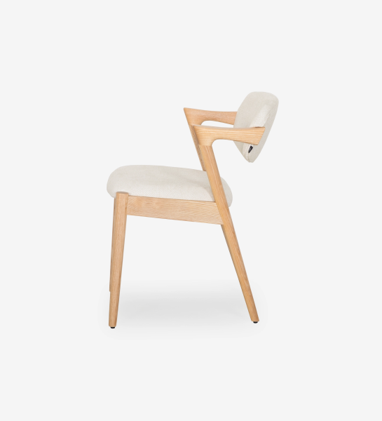 Elba Chair side view with light wood frame and beige upholstered seat and back