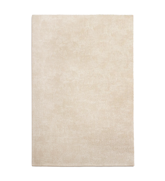 Tapis beige avec texture torsadée, finition Line.