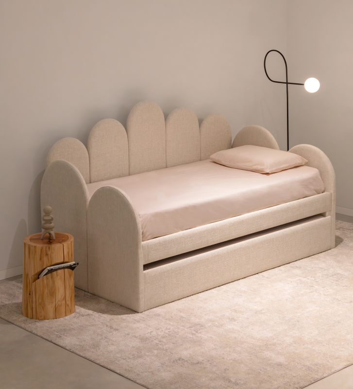 Divan Bed with upholstered frame and front in pearl fabric, featuring a bed in the lower drawer.