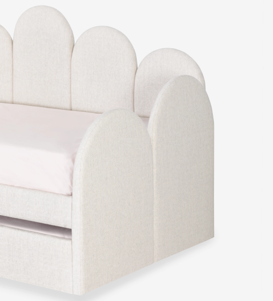 Divan Bed with upholstered frame and front in pearl fabric, featuring a bed in the lower drawer.