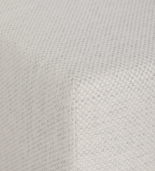 Pouf Nice en tissu beige clair texturé, gros plan sur le coin et la couture