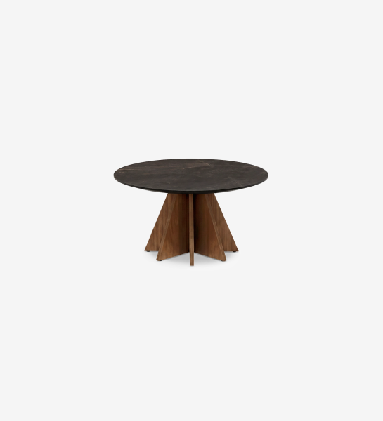Lagos Center Table with round dark stone top and star-shaped wooden pedestal base