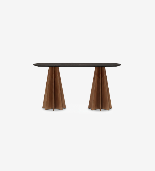 Lagos Console with dark oval top and two sculpted wooden pleated pedestal bases
