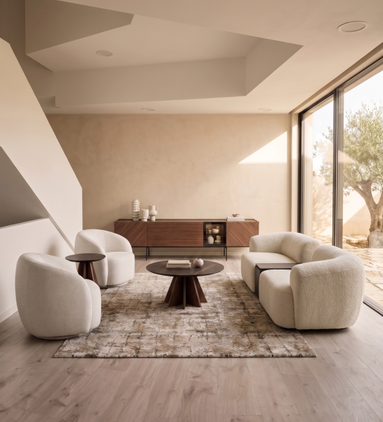 Lagos Side Table next to curved cream armchair in minimalist sunlit living room