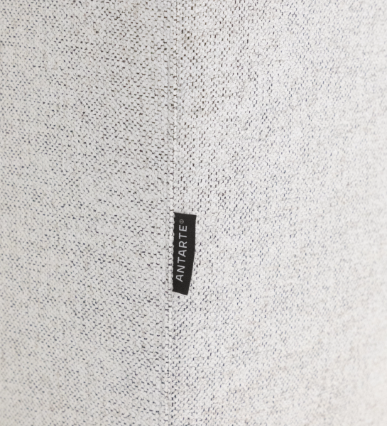 Close-up of Lagos Sofa with Chaise Longue beige textured upholstery with black ANTARTE label